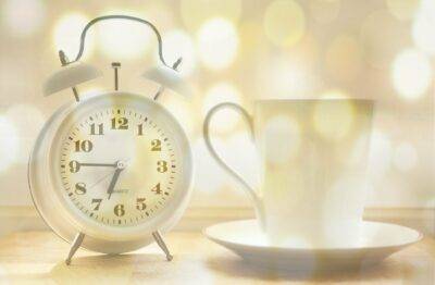 alarm clock, coffee cup, time of